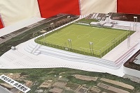写真：起工式会場に設けられたサッカー場のイメージ模型